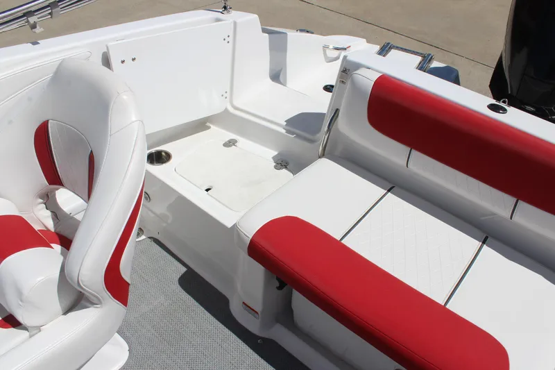 Slide: The Image of 2022 Tahoe 2150 boat interior with red and white seating and storage area. - 11