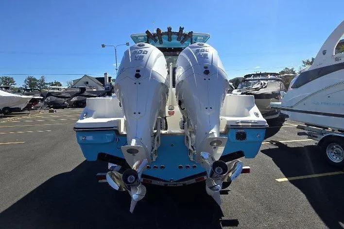 Slide: The Image of 2026 Key West 263 FS boat with dual outboard engines in a marina. - 4