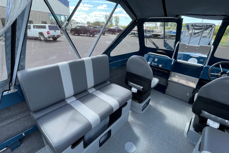 Slide: The Image of Interior of 2026 Hewescraft 200 ProV boat with gray seating and modern design. - 11
