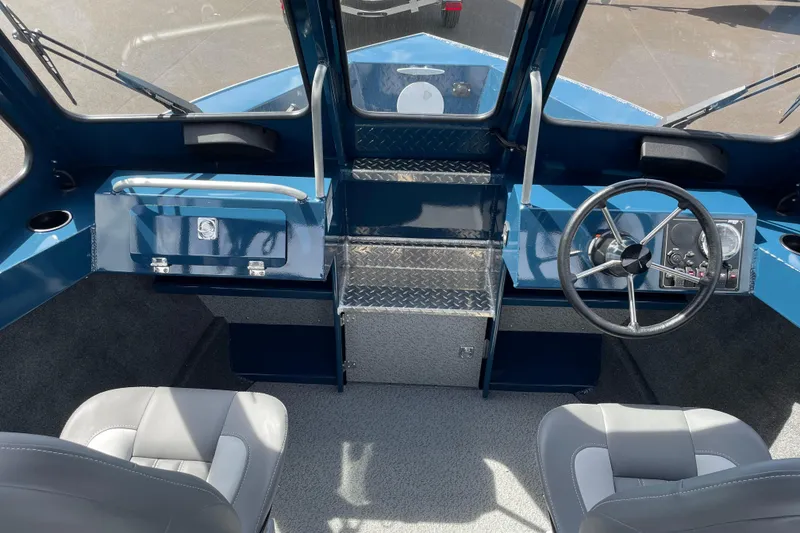 Slide: The Image of 2026 Hewescraft 200 ProV boat interior with steering wheel and seating. - 14