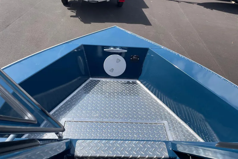 Slide: The Image of 2026 Hewescraft 200 ProV boat bow with diamond plate flooring, blue interior. - 19