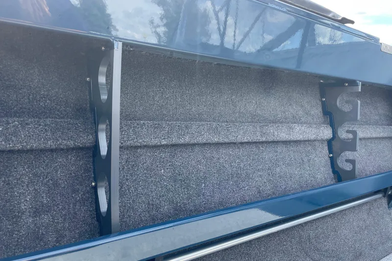 Slide: The Image of 2026 Hewescraft 200 ProV boat interior detail with blue and gray design. - 22