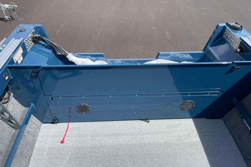 Slide: The Image of 2026 Hewescraft 200 ProV boat interior, featuring blue paneling and wiring details. - 7