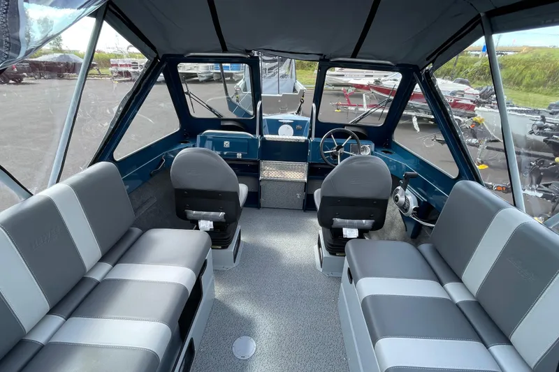 Slide: The Image of Interior of 2026 Hewescraft 200 ProV boat with seating and steering wheel. - 8