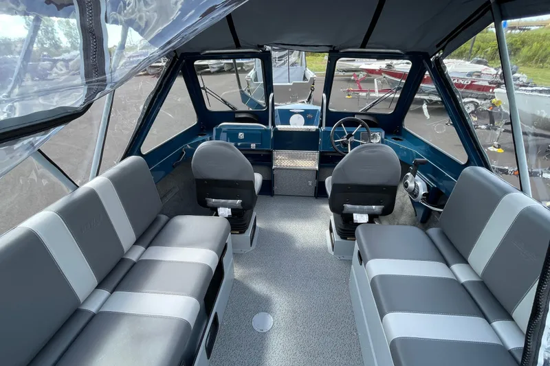 Slide: The Image of Interior of 2026 Hewescraft 200 ProV boat with seating and steering console. - 9