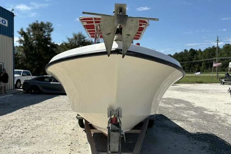Slide: The Image of 2001 May-Craft 2300 CC boat on trailer, front view, outdoors. - 4