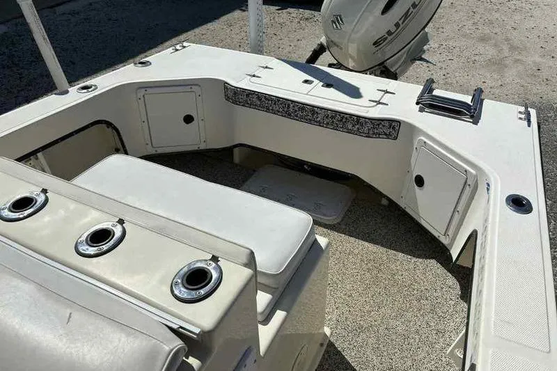 Slide: The Image of 2001 May-Craft 2300 CC boat interior with seating and storage compartments. - 8