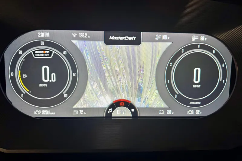 Slide: The Image of 2023 MasterCraft X24 dashboard display showing speed, RPM, and fuel levels. - 13