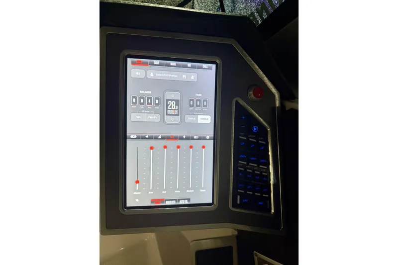 Slide: The Image of 2023 MasterCraft X24 touchscreen control panel with digital interface and adjustment sliders. - 14