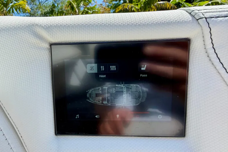 Slide: The Image of 2023 MasterCraft X24 touchscreen display showing heating controls and boat layout. - 19