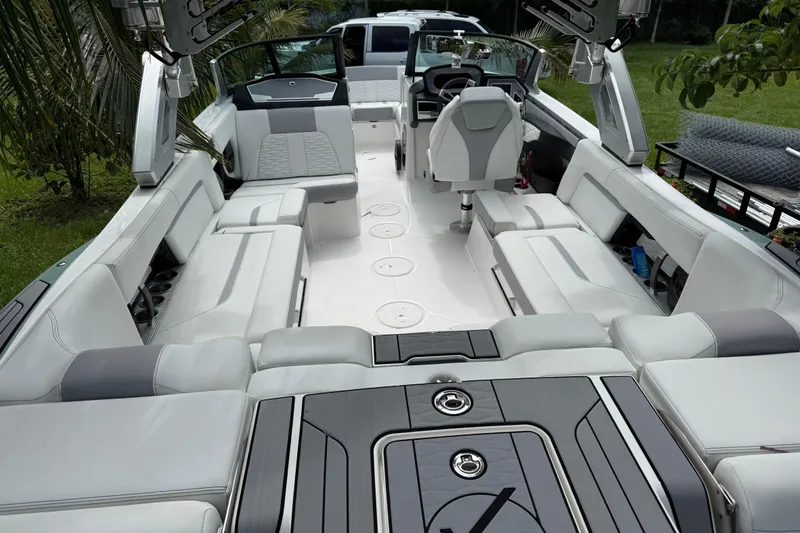 Slide: The Image of 2023 MasterCraft X24 boat interior with luxurious seating and modern design. - 2