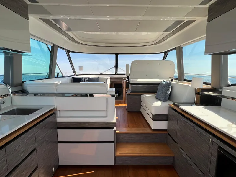 Slide: The Image of Luxurious interior of 2021 Tiara Yachts C49 Coupe with modern design and panoramic windows. - 13
