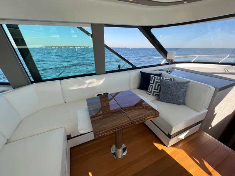 Slide: The Image of Luxurious interior of 2021 Tiara Yachts C49 Coupe with ocean view. - 18