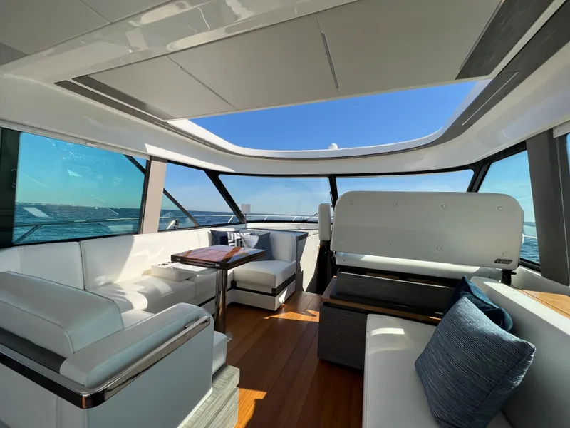 Slide: The Image of Luxurious interior of 2021 Tiara Yachts C49 Coupe with panoramic windows and elegant seating. - 19