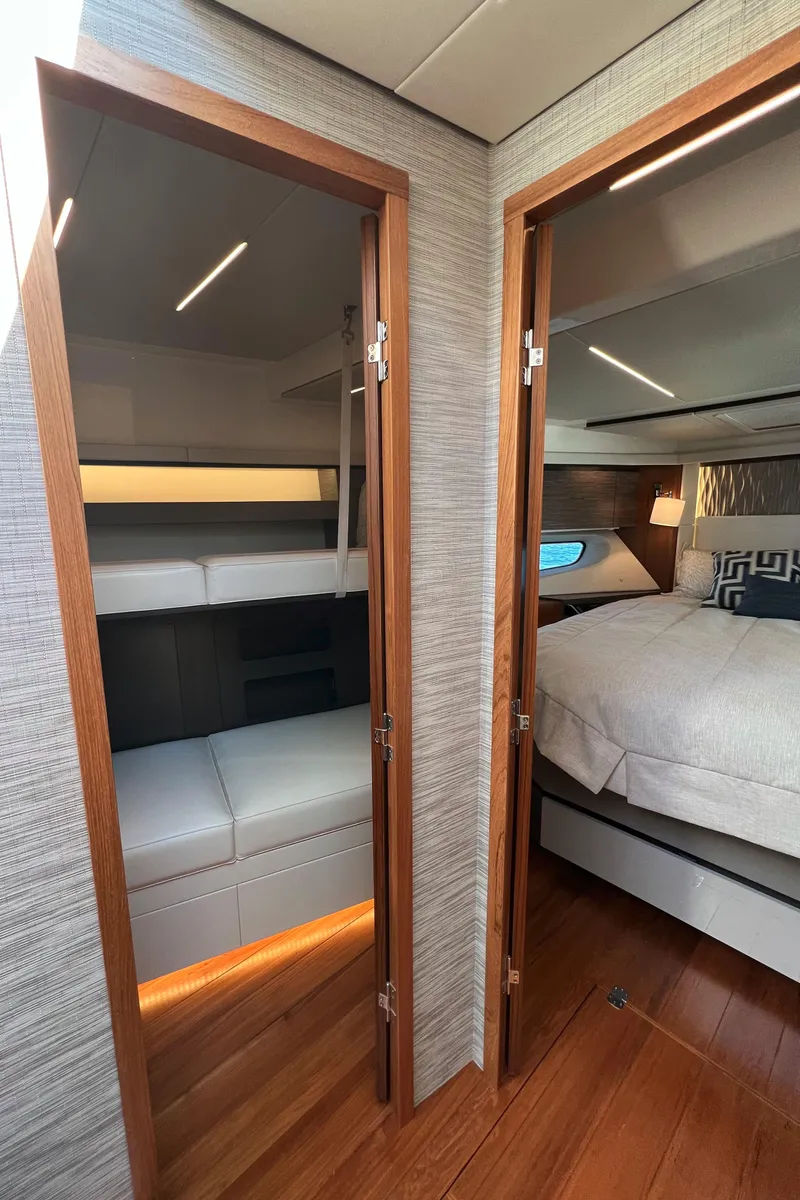 Slide: The Image of Interior of 2021 Tiara Yachts C49 Coupe, featuring cozy cabin and modern design. - 31