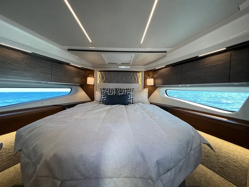 Slide: The Image of Luxurious bedroom interior of 2021 Tiara Yachts C49 Coupe with ocean view windows. - 33