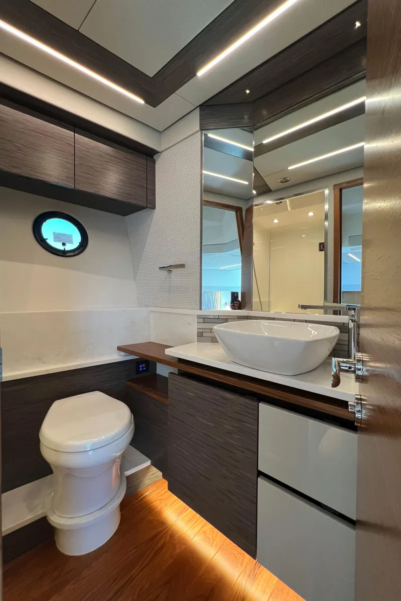Slide: The Image of Luxurious bathroom in 2021 Tiara Yachts C49 Coupe with modern fixtures and elegant design. - 35