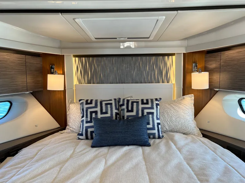 Slide: The Image of Luxurious 2021 Tiara Yachts C49 Coupe bedroom with elegant bedding and ambient lighting. - 41