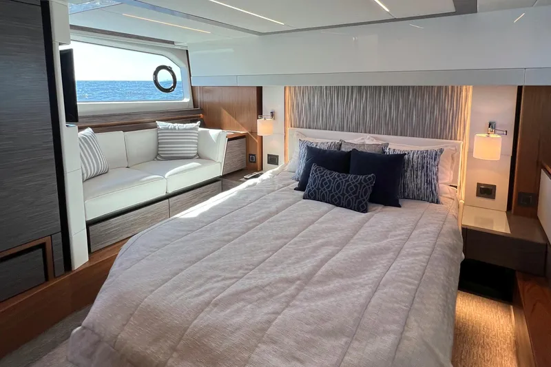 Slide: The Image of Luxurious 2021 Tiara Yachts C49 Coupe bedroom with ocean view and elegant decor. - 42