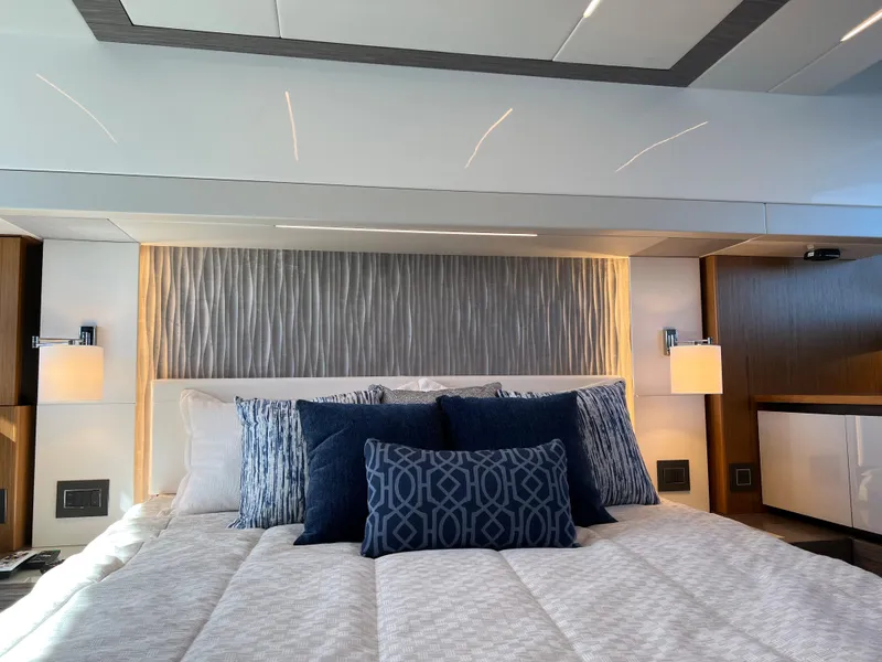 Slide: The Image of Luxurious bedroom interior of 2021 Tiara Yachts C49 Coupe with elegant bedding and modern lighting. - 44