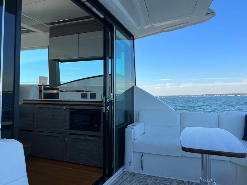 Slide: The Image of Interior view of 2021 Tiara Yachts C49 Coupe with ocean backdrop. - 6