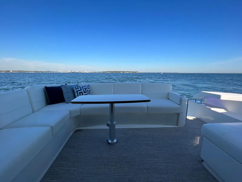 Slide: The Image of Luxurious seating area on 2021 Tiara Yachts C49 Coupe with ocean view. - 8