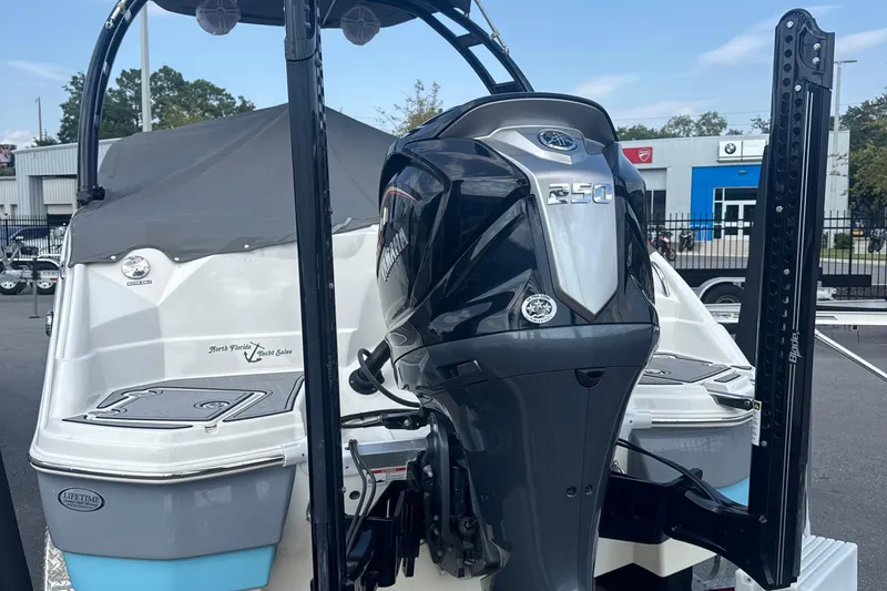 Slide: The Image of 2022 NauticStar 243 DC boat with Yamaha 250 engine, displayed outdoors. - 11