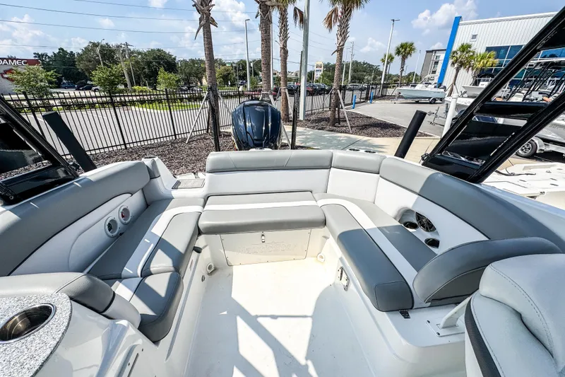 Slide: The Image of 2022 NauticStar 243 DC boat interior with gray seating and modern design. - 6