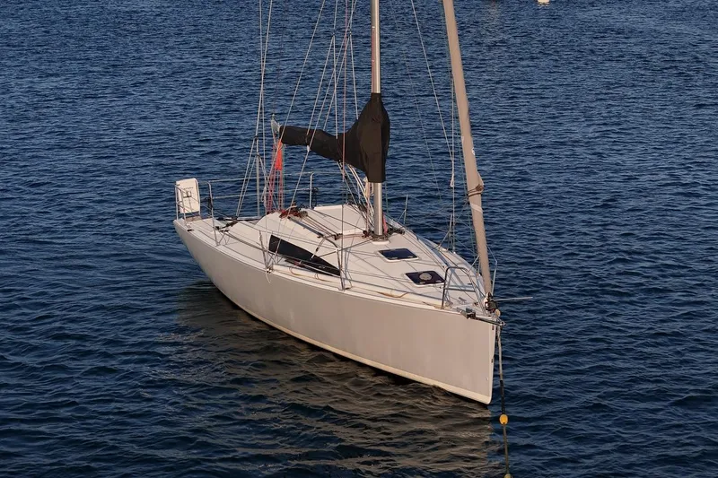 Slide: The Image of 2017 Jeanneau SunFast 3200 sailboat on calm blue water. - 12