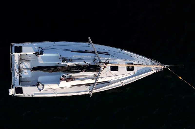 Slide: The Image of Overhead view of 2017 Jeanneau SunFast 3200 sailboat on dark water. - 15