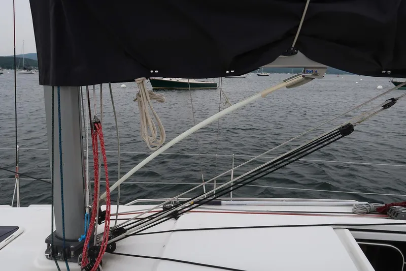 Slide: The Image of 2017 Jeanneau SunFast 3200 sailboat deck with rigging and ropes on a calm sea. - 22