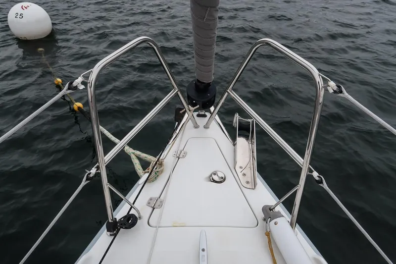 Slide: The Image of Bow of 2017 Jeanneau SunFast 3200 sailboat with mooring buoy in water. - 23