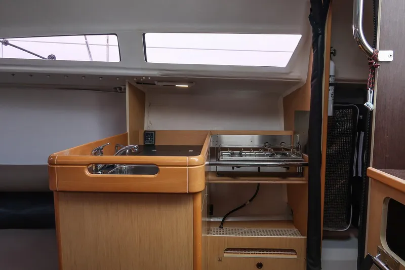 Slide: The Image of 2017 Jeanneau SunFast 3200 yacht interior with compact kitchen and modern design. - 30