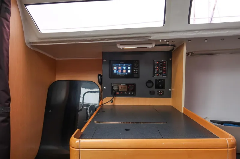 Slide: The Image of Interior control panel of 2017 Jeanneau SunFast 3200 sailboat, featuring navigation equipment. - 34