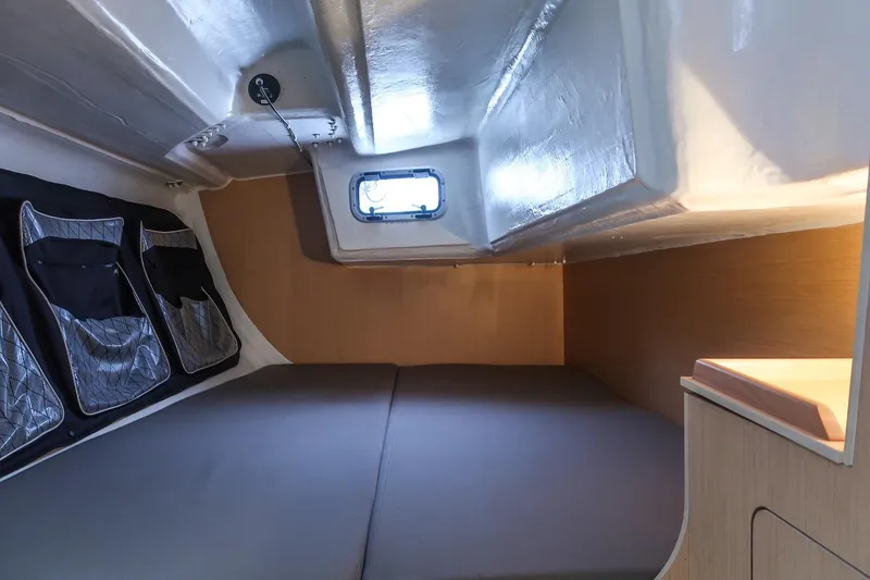 Slide: The Image of Cozy cabin interior of 2017 Jeanneau SunFast 3200 sailboat with storage pockets and window. - 36