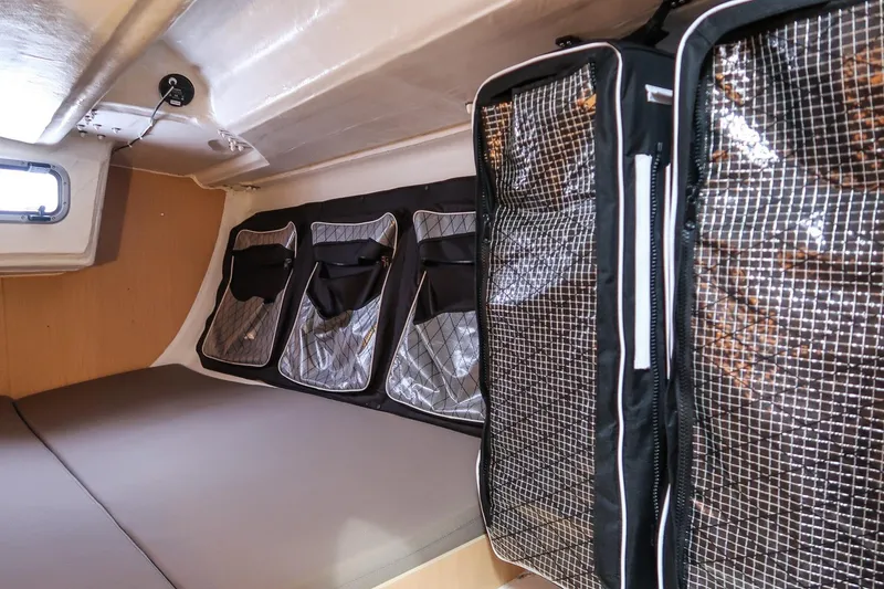 Slide: The Image of Interior cabin of 2017 Jeanneau SunFast 3200 with storage compartments and bedding. - 38
