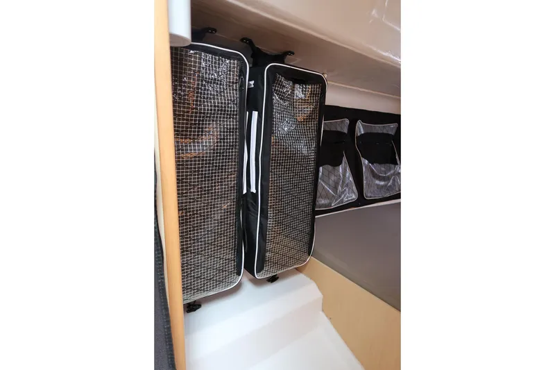 Slide: The Image of Interior storage of 2017 Jeanneau SunFast 3200 sailboat with mesh and fabric compartments. - 39