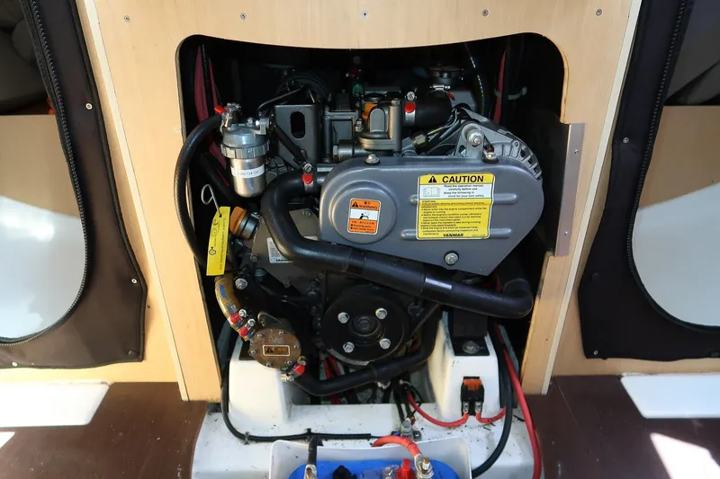 Slide: The Image of Engine compartment of 2017 Jeanneau SunFast 3200 sailboat, showcasing Yanmar engine details. - 46