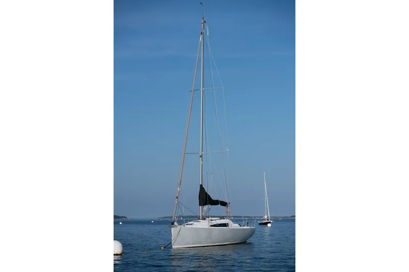 Slide: The Image of 2017 Jeanneau SunFast 3200 sailboat on calm blue water under clear sky. - 6