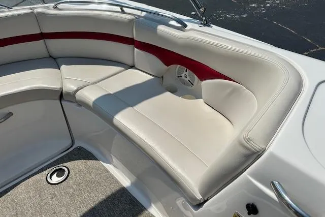 Slide: The Image of 2003 Chaparral Sunesta 222 boat interior with white and red cushioned seating. - 28