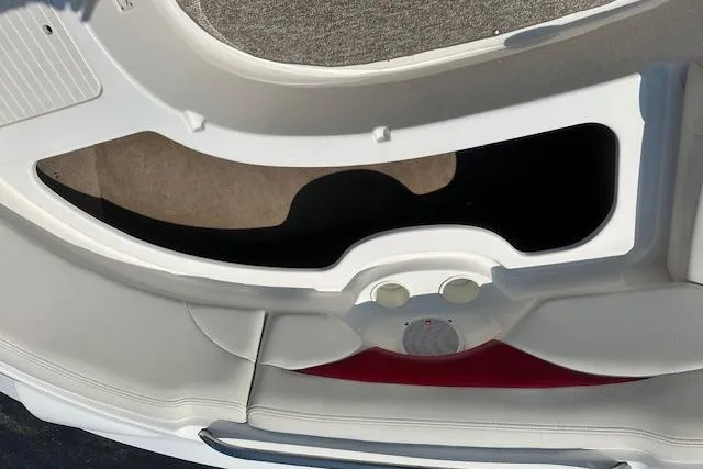 Slide: The Image of 2003 Chaparral Sunesta 222 boat interior with storage compartments and seating. - 32