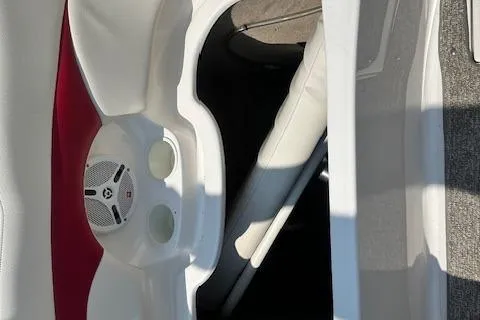 Slide: The Image of 2003 Chaparral Sunesta 222 boat interior with speaker and storage compartment. - 33