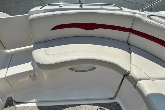 Slide: The Image of 2003 Chaparral Sunesta 222 boat interior with white and red cushioned seating. - 34