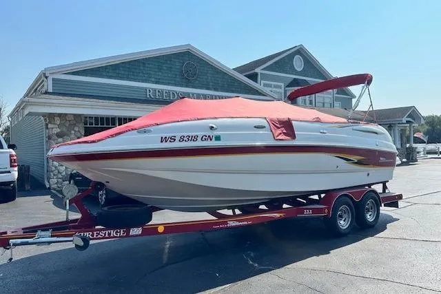 Slide: The Image of 2003 Chaparral Sunesta 222 boat on trailer, parked outside a building. - 36