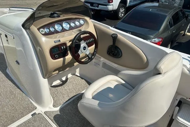 Slide: The Image of 2003 Chaparral Sunesta 222 boat cockpit with steering wheel and control panel. - 9