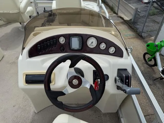 Slide: The Image of 2008 Bennington 2277FSi boat dashboard with steering wheel and control panel. - 18