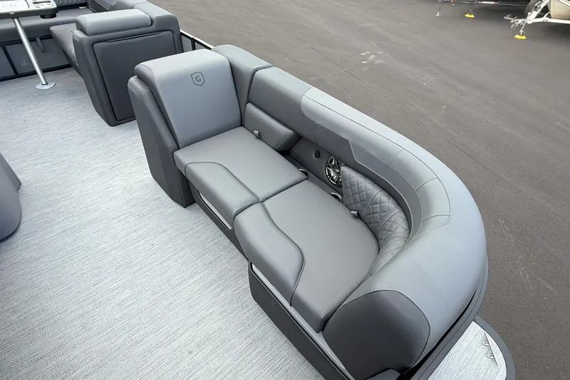 Slide: The Image of Luxurious seating on 2026 Godfrey SWEETWATER 2286 SFL pontoon boat, featuring sleek gray upholstery. - 11