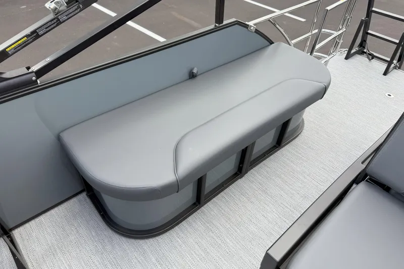 Slide: The Image of 2026 Godfrey SWEETWATER 2286 SFL boat interior with sleek gray seating. - 19