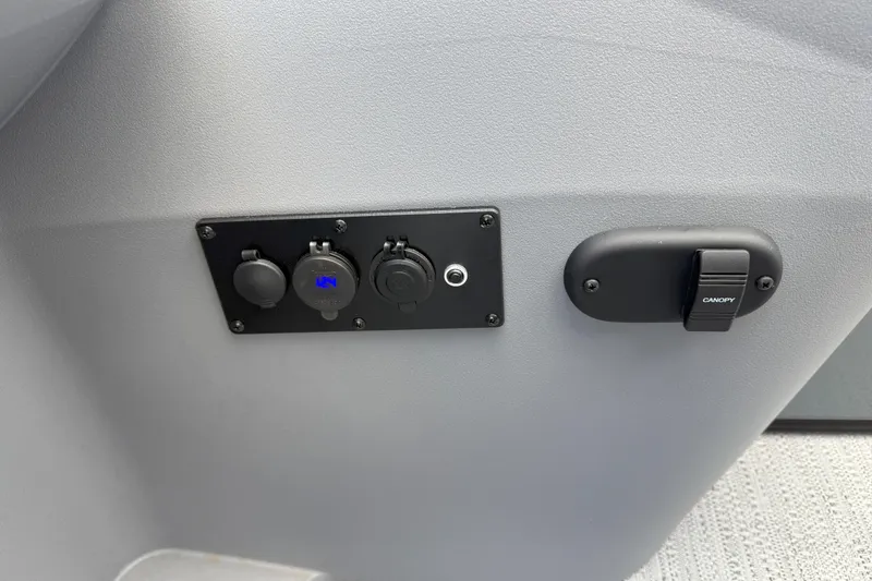 Slide: The Image of Control panel on 2026 Godfrey SWEETWATER 2286 SFL boat, featuring canopy switch and outlets. - 20