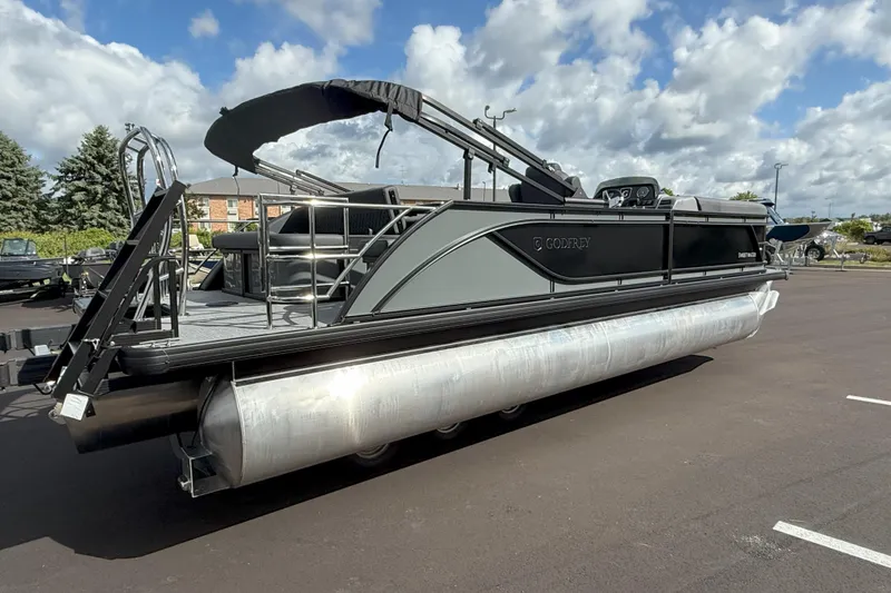 Slide: The Image of 2026 Godfrey SWEETWATER 2286 SFL pontoon boat on a sunny day, parked on asphalt. - 8